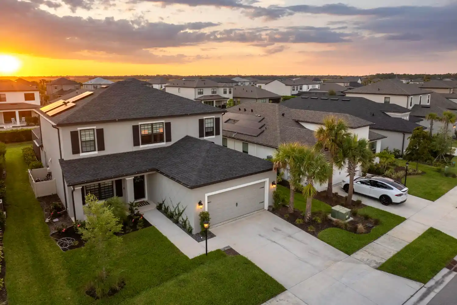 A comfortable suburban family home with a green lawn.